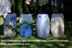 four painted rain barrels